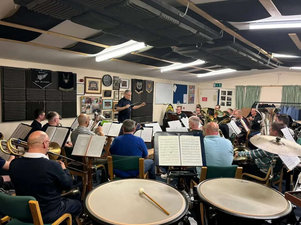 KNDS Fairey Band musicians and conductor rehearsing ahead of the Perth Festival premiere