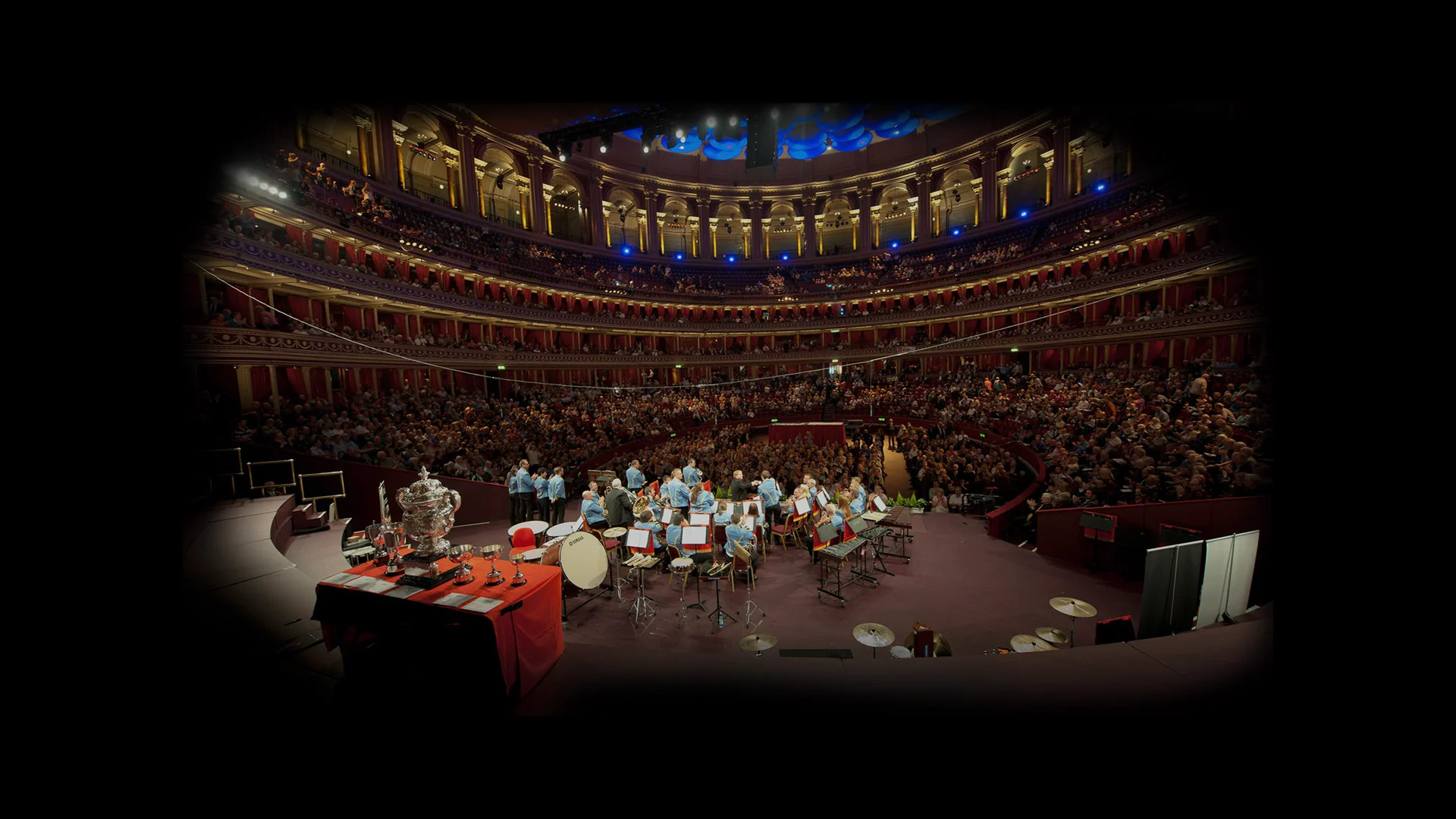 The KNDS Fairey Band performing on stage at the Royal Albert Hall to a packed audience